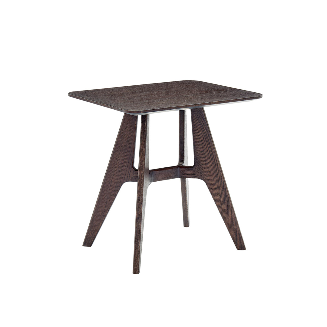 Natuzzi Editions indoor furniture including lounge armchairs, coffee tables, side tables, and bedside tables at Royal Interiors Singapore showroom.