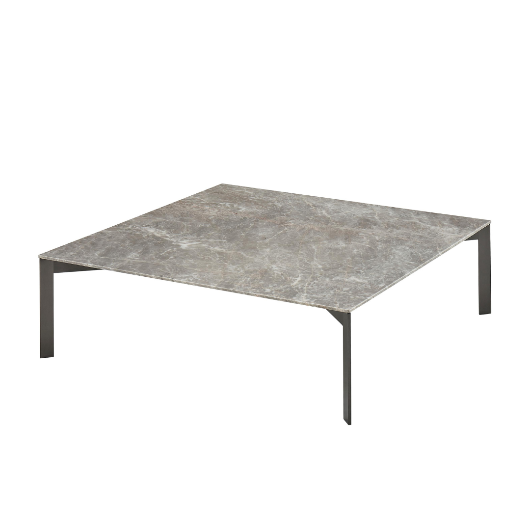 Natuzzi Editions indoor furniture including lounge armchairs, coffee tables, side tables, and bedside tables at Royal Interiors Singapore showroom.