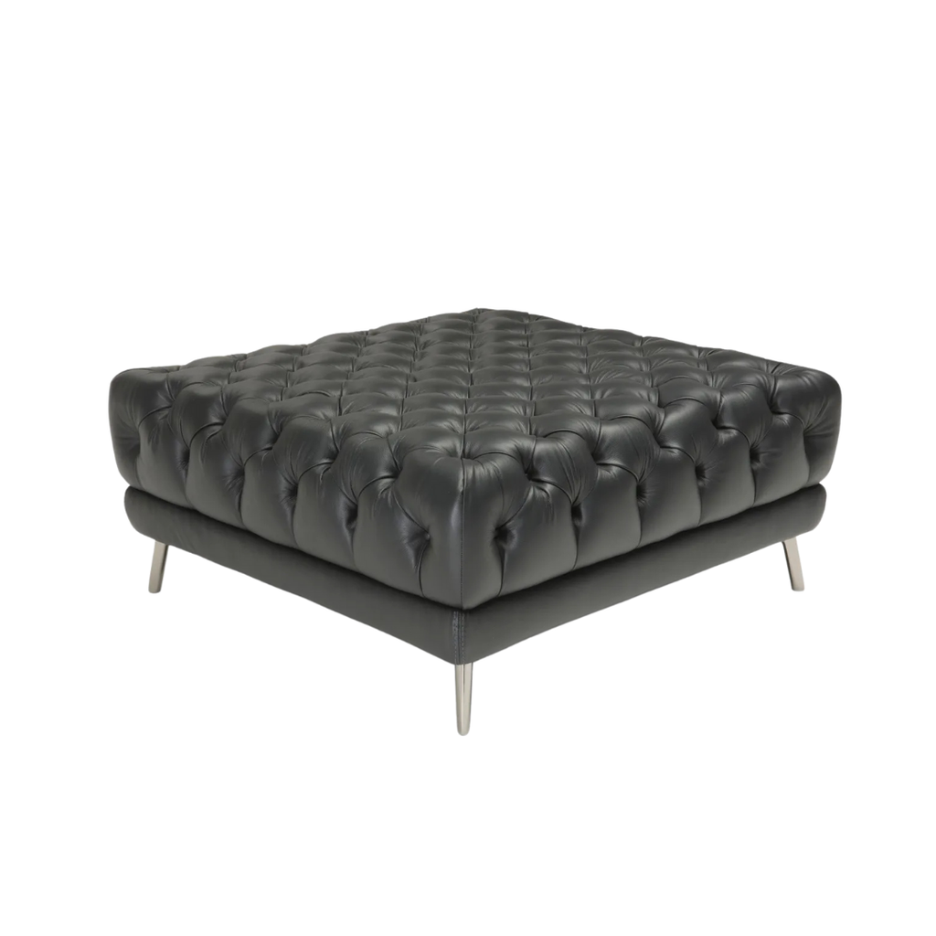 Natuzzi Italia indoor furniture including lounge armchairs, coffee tables, side tables, and bedside tables at Royal Interiors Singapore showroom.