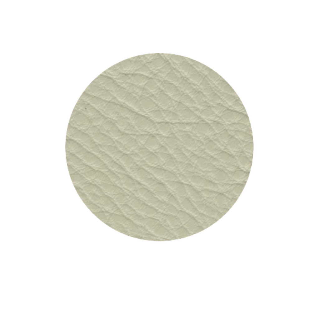 Natuzzi Italia indoor furniture including lounge armchairs, coffee tables, side tables, and bedside tables at Royal Interiors Singapore showroom.