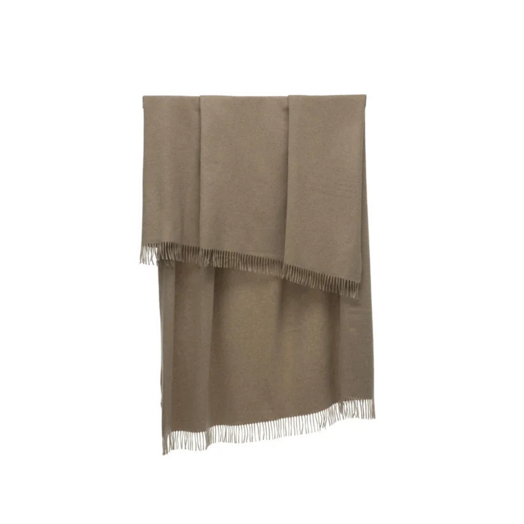 Natuzzi Italia indoor furniture including lounge armchairs, coffee tables, side tables, and bedside tables at Royal Interiors Singapore showroom.