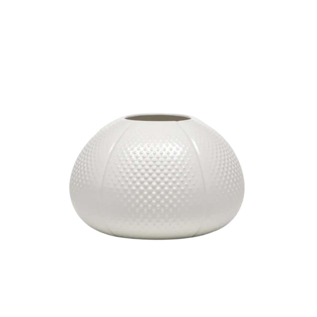 Natuzzi Italia indoor furniture including lounge armchairs, coffee tables, side tables, and bedside tables at Royal Interiors Singapore showroom.