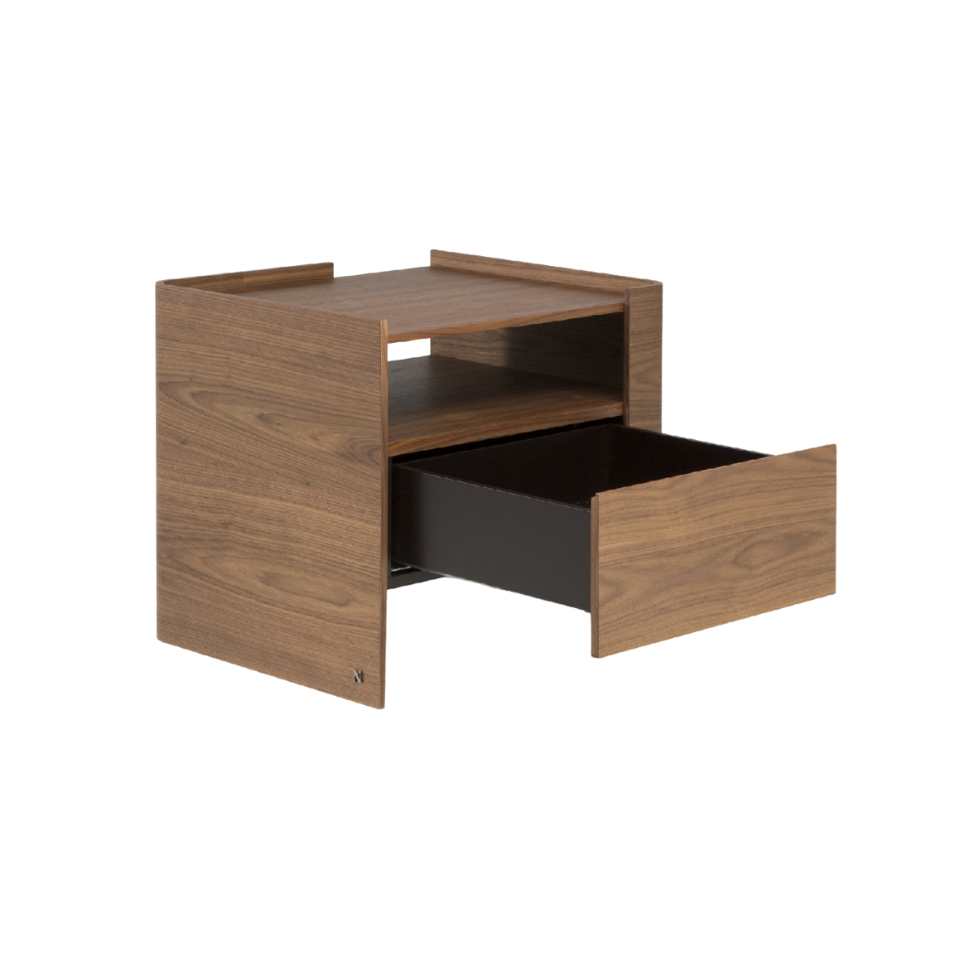 Natuzzi Italia indoor furniture including lounge armchairs, coffee tables, side tables, and bedside tables at Royal Interiors Singapore showroom.