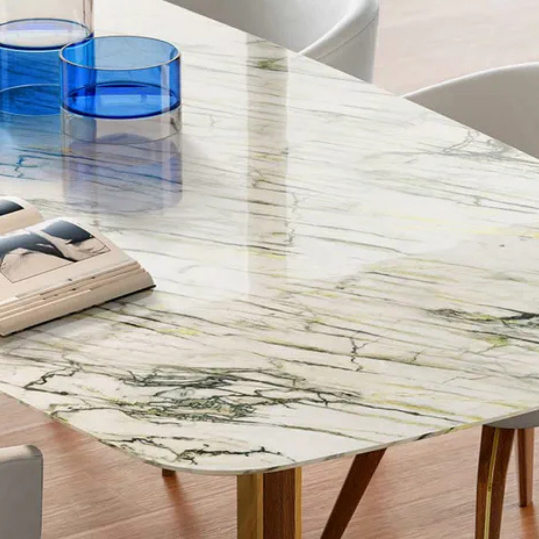 Natuzzi Italia indoor furniture including lounge armchairs, coffee tables, side tables, and bedside tables at Royal Interiors Singapore showroom.