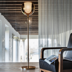 Penta Italian designer lighting featuring sculptural mirrored floor and pendant lights displayed in a luxury Singapore showroom