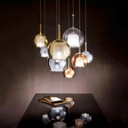 Penta Italian designer lighting featuring sculptural mirrored floor and pendant lights displayed in a luxury Singapore showroom