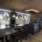 Penta Italian designer lighting featuring sculptural mirrored floor and pendant lights displayed in a luxury Singapore showroom