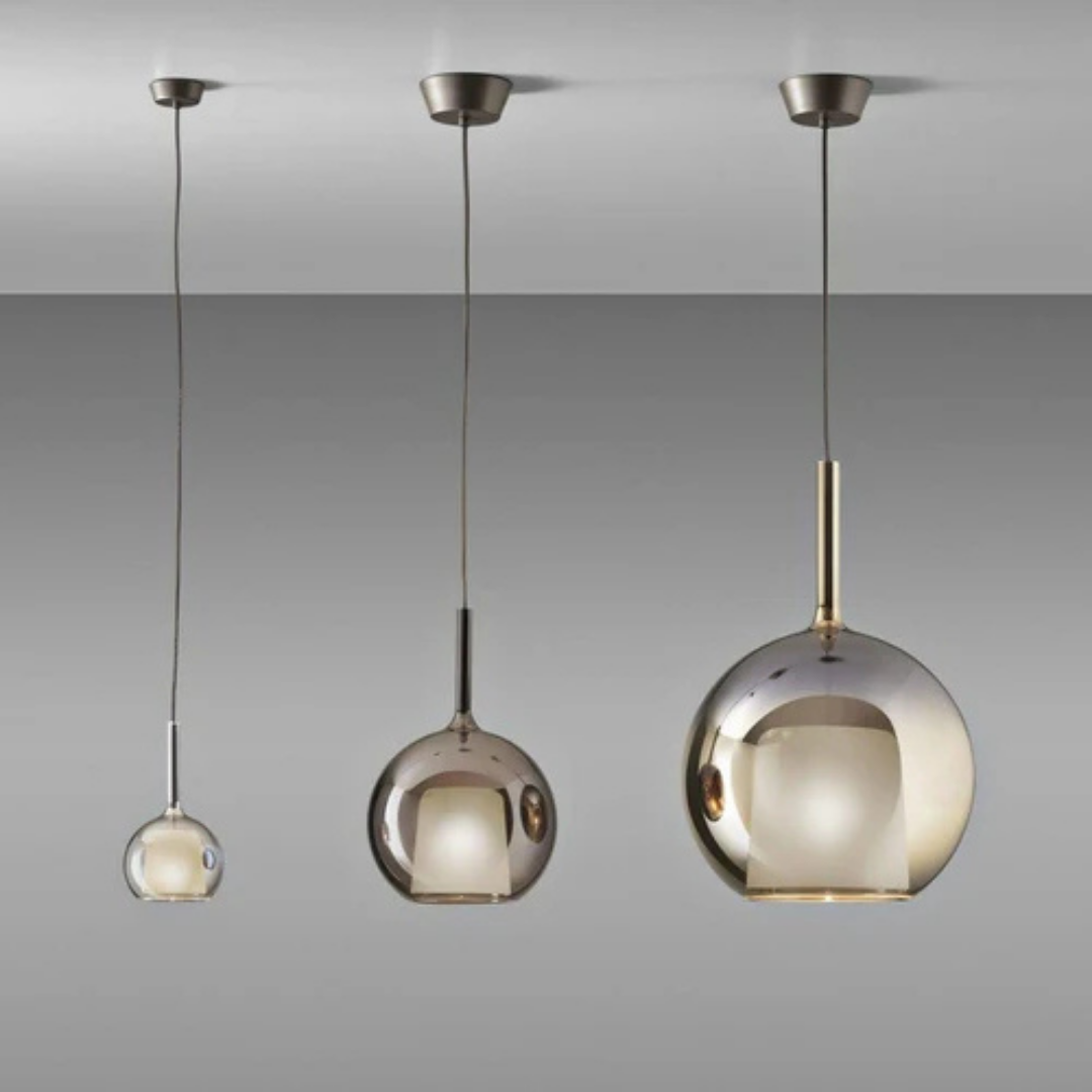 Penta Italian designer lighting featuring sculptural mirrored floor and pendant lights displayed in a luxury Singapore showroom