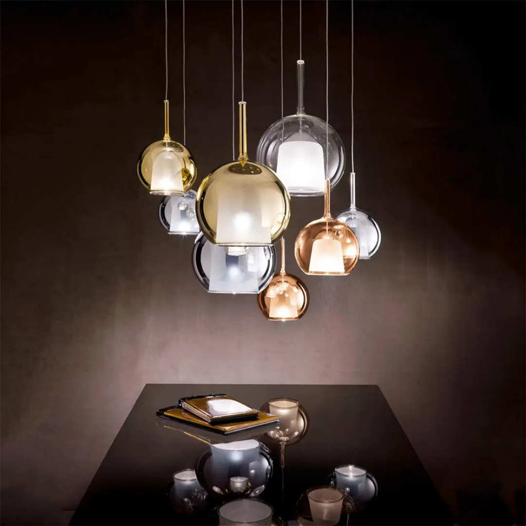 Penta Italian designer lighting featuring sculptural mirrored floor and pendant lights displayed in a luxury Singapore showroom