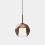 Penta Italian designer lighting featuring sculptural mirrored floor and pendant lights displayed in a luxury Singapore showroom