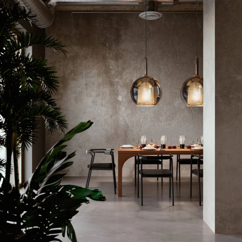 Penta Italian designer lighting featuring sculptural mirrored floor and pendant lights displayed in a luxury Singapore showroom