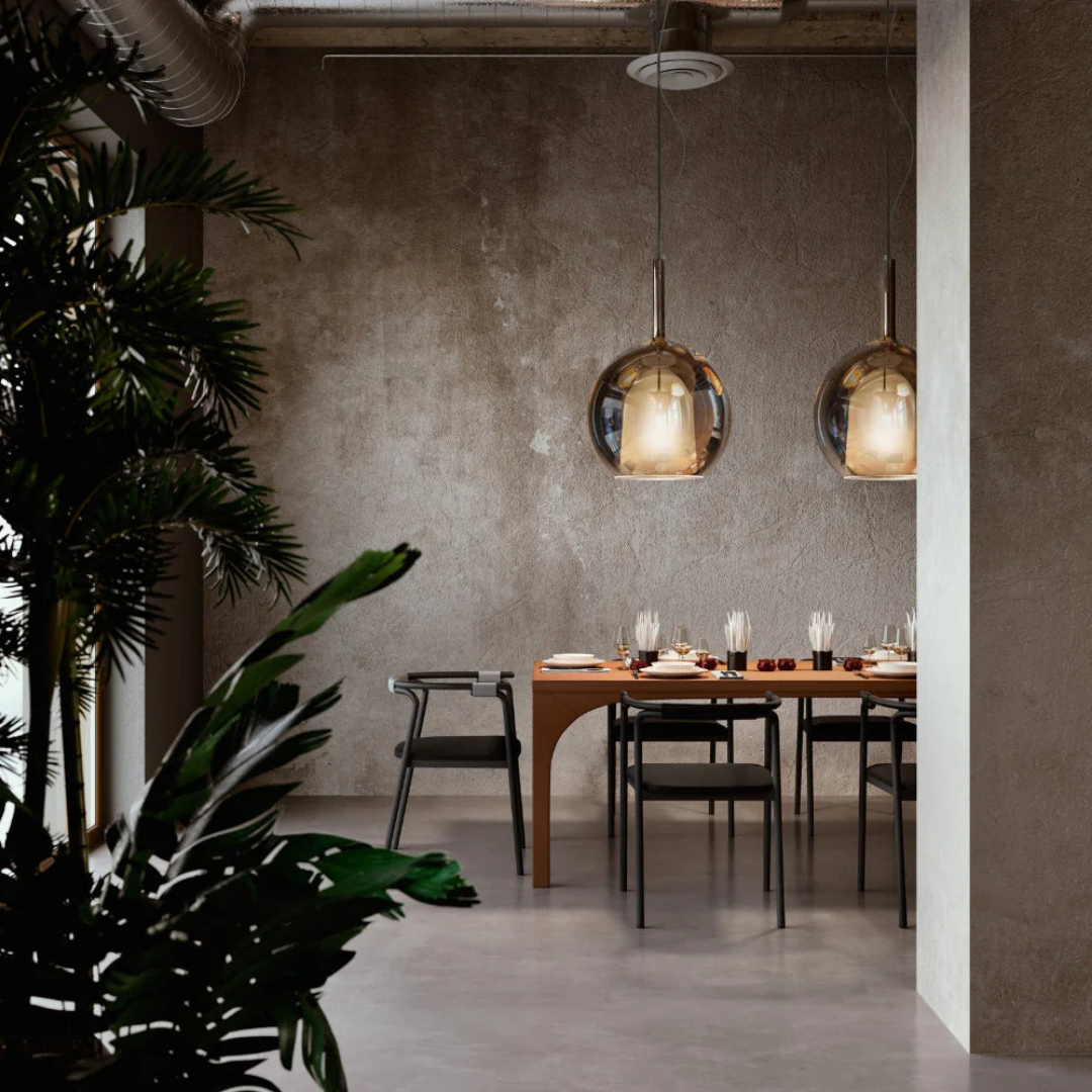 Penta Italian designer lighting featuring sculptural mirrored floor and pendant lights displayed in a luxury Singapore showroom