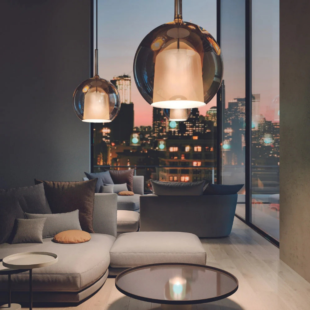 Penta Italian designer lighting featuring sculptural mirrored floor and pendant lights displayed in a luxury Singapore showroom