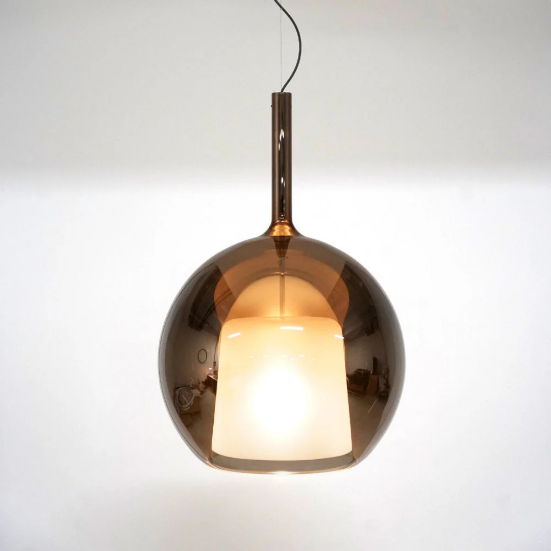 Penta Italian designer lighting featuring sculptural mirrored floor and pendant lights displayed in a luxury Singapore showroom