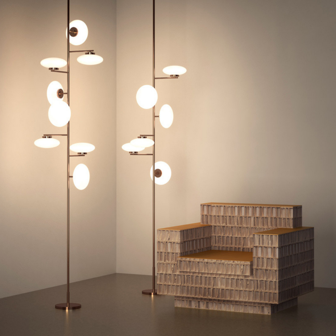 Penta Italian designer lighting featuring sculptural mirrored floor and pendant lights displayed in a luxury Singapore showroom