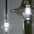 Penta Italian designer lighting featuring sculptural mirrored floor and pendant lights displayed in a luxury Singapore showroom