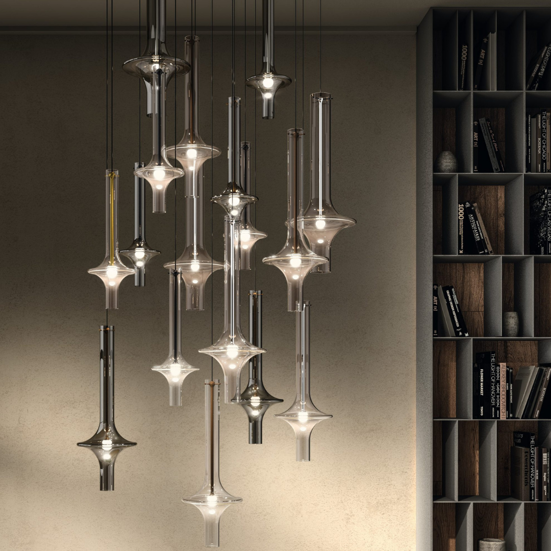 Penta Italian designer lighting featuring sculptural mirrored floor and pendant lights displayed in a luxury Singapore showroom