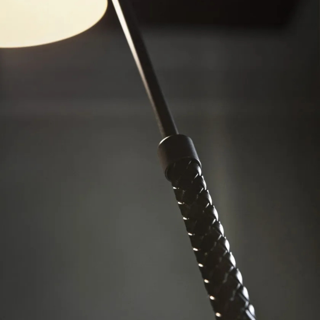 Penta Italian designer lighting featuring sculptural mirrored floor and pendant lights displayed in a luxury Singapore showroom