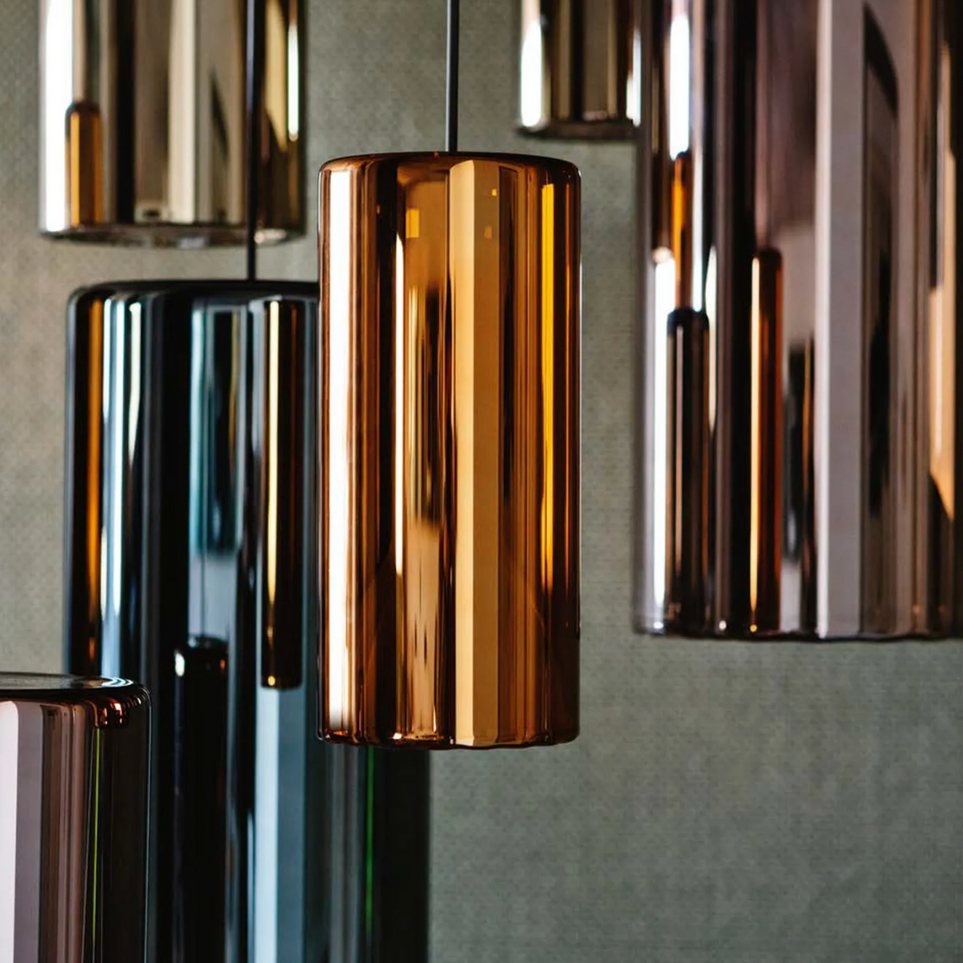 Penta Italian designer lighting featuring sculptural mirrored floor and pendant lights displayed in a luxury Singapore showroom