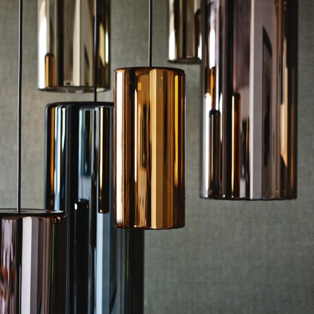 Penta Italian designer lighting featuring sculptural mirrored floor and pendant lights displayed in a luxury Singapore showroom