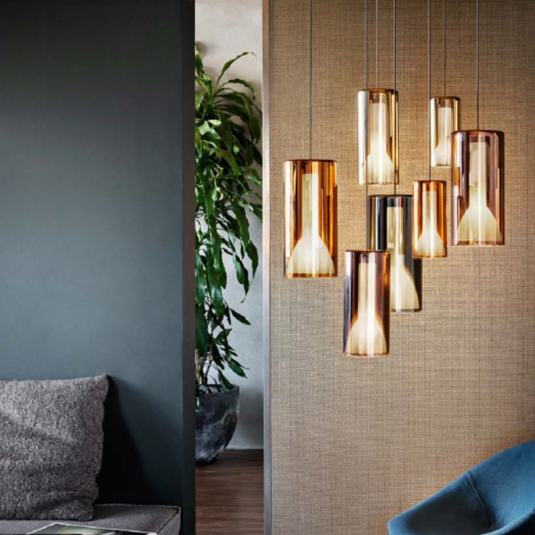 Penta Italian designer lighting featuring sculptural mirrored floor and pendant lights displayed in a luxury Singapore showroom