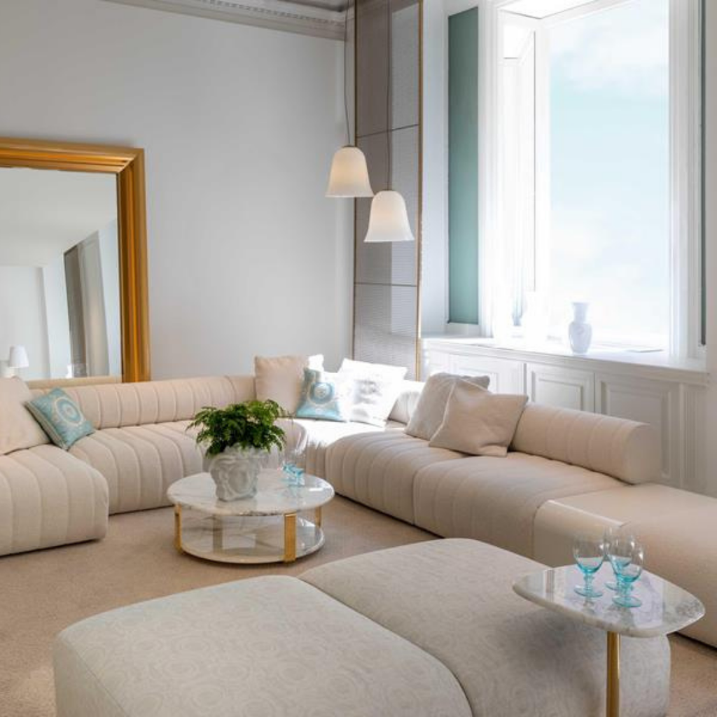 Versace Home furniture with signature Medusa and La Greca detailing, available at Royal Interiors Singapore.