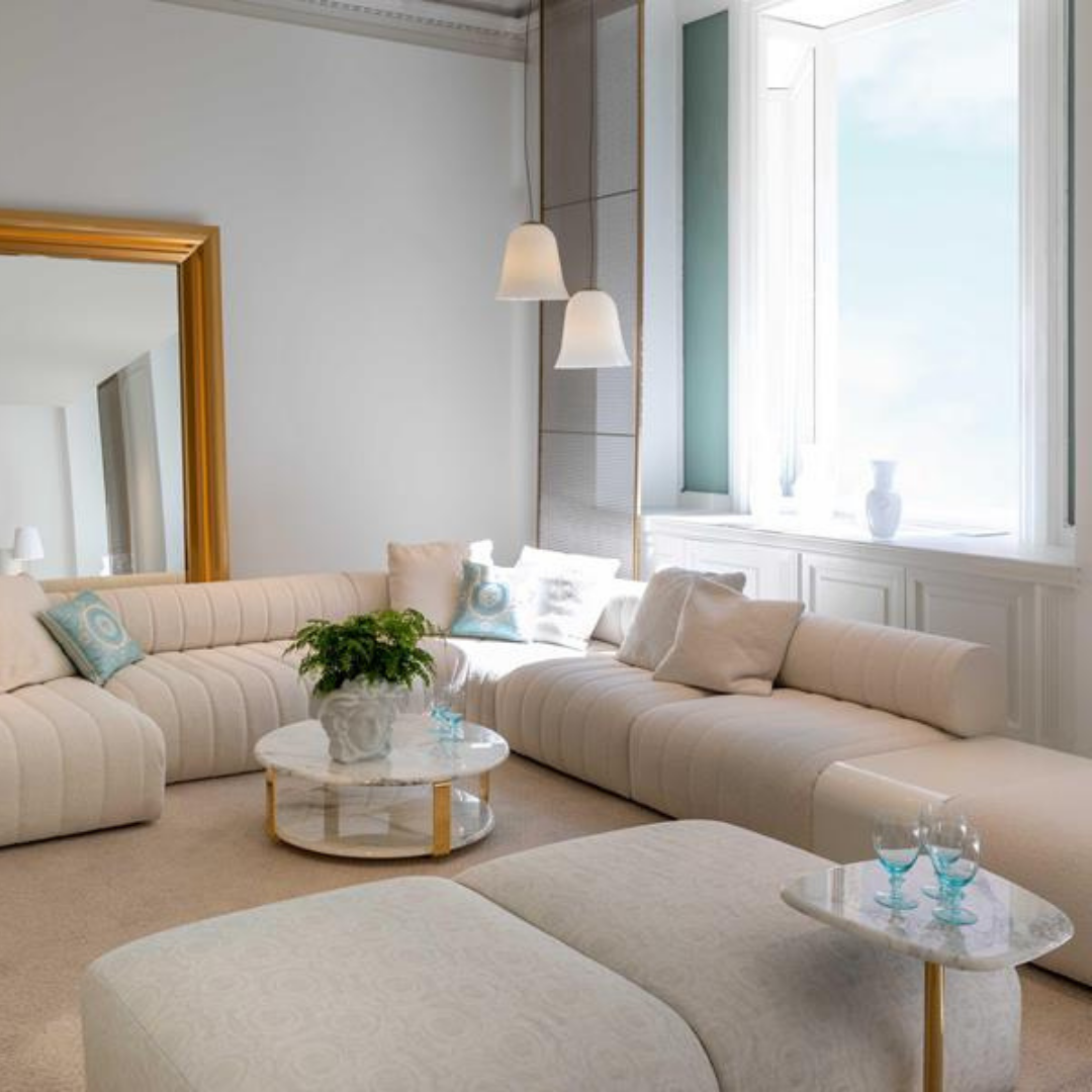 Versace Home furniture with signature Medusa and La Greca detailing, available at Royal Interiors Singapore.