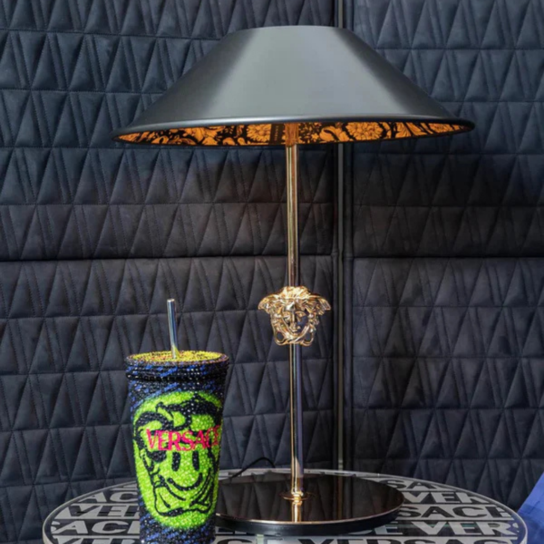 Versace Home furniture with signature Medusa and La Greca detailing, available at Royal Interiors Singapore.