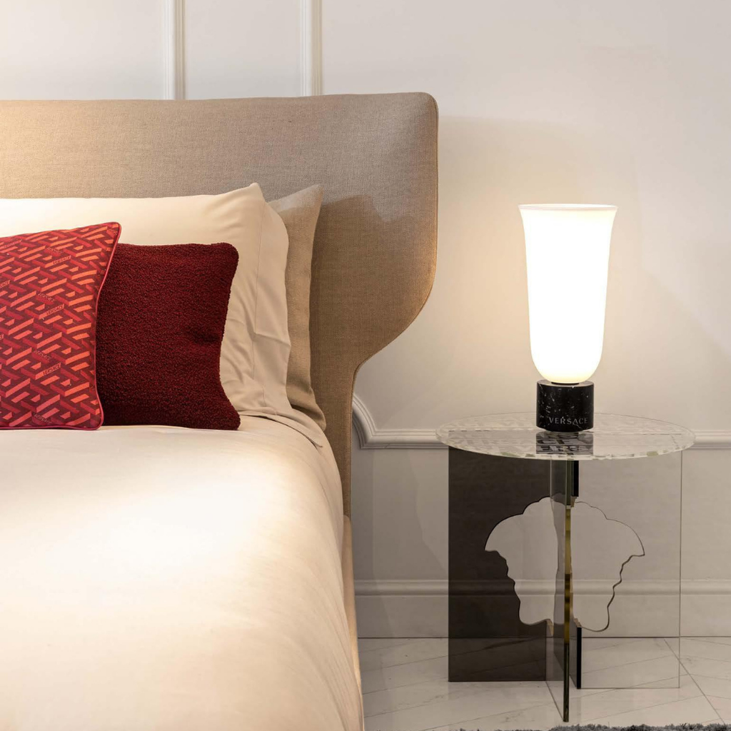 Versace Home furniture with signature Medusa and La Greca detailing, available at Royal Interiors Singapore.