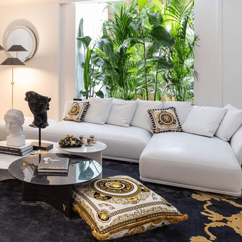 Versace Home furniture with signature Medusa and La Greca detailing, available at Royal Interiors Singapore.