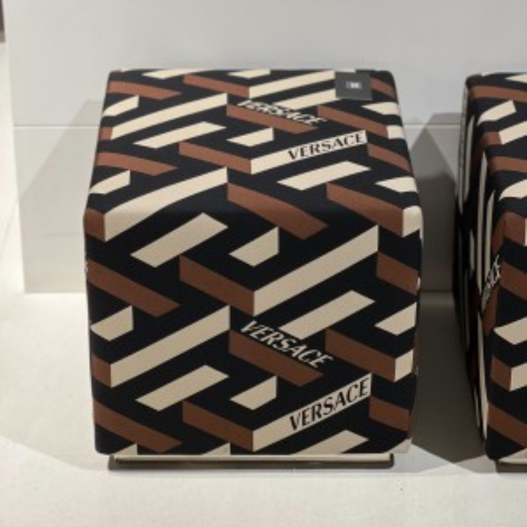 Versace Home furniture with signature Medusa and La Greca detailing, available at Royal Interiors Singapore.