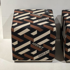 Versace Home furniture with signature Medusa and La Greca detailing, available at Royal Interiors Singapore.