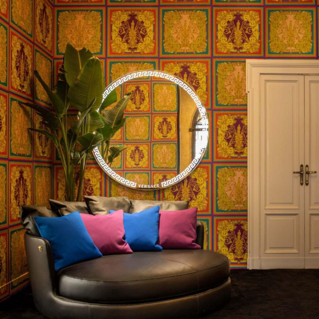 Versace Home furniture with signature Medusa and La Greca detailing, available at Royal Interiors Singapore.