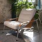 Luxury lounge armchair from Royal Interiors Singapore — designer seating crafted for modern comfort and timeless style.