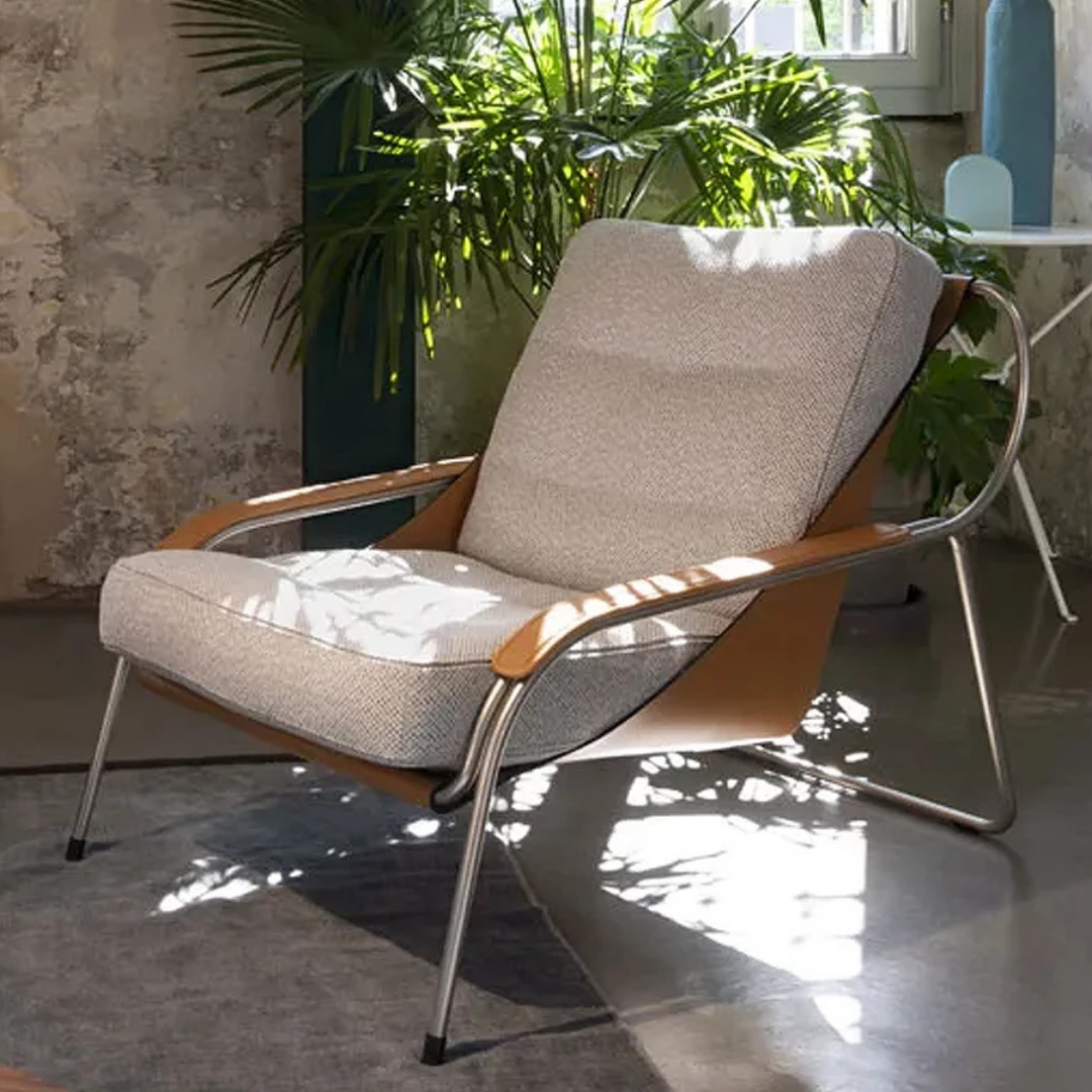 Luxury lounge armchair from Royal Interiors Singapore — designer seating crafted for modern comfort and timeless style.